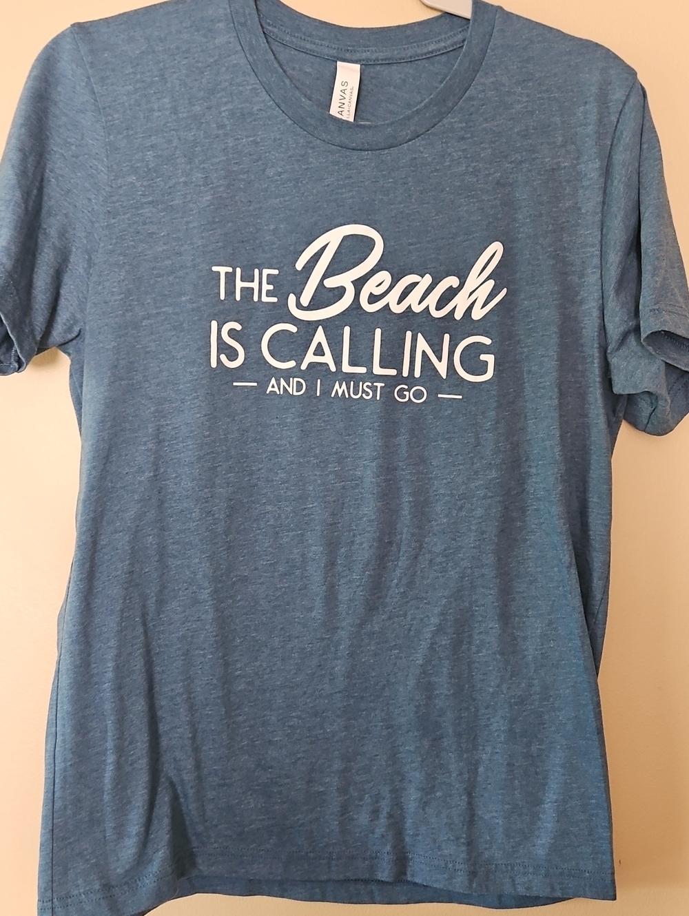 Bella Canvas Blue Heather "The Beach Is Calling" Short Sleeve Tee